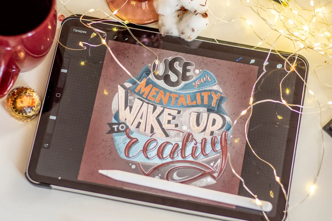 A sleek laptop on a wooden table showing a smartphone advertisement, perfect for tech and gadget content.